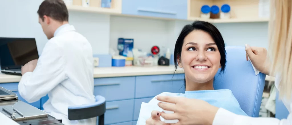 Staff discussing with client our smile makeover services in North Brisbane.